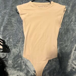 Padded shoulder nude bodysuit